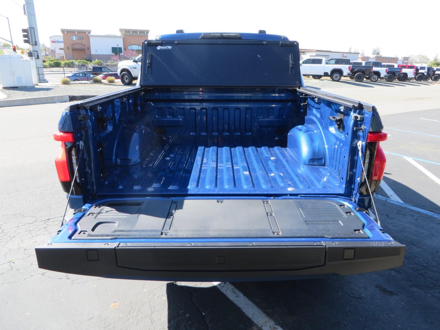 2022 BLUE /BLACK Ford F-150 Lariat Crew Cab 4WD (1FT6W1EV6NW) , located at 2630 Grass Valley Highway, Auburn, CA, 95603, (530) 508-5100, 38.937893, -121.095482 - Tired of gas prices and still want to look cool? Check out this Ford Lightning featuring a RC level kit, Nitto Ridge Grappler tires, Fuel Rebel wheels, Sinister front and rear bumpers, Baja Designs leds, Rigid Industries Leds, Bakflip F1, and window tint. - Photo#13